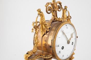 A Louis XVI marble and ormolu portico clock, the dial signed Bouchet, late 18th century.