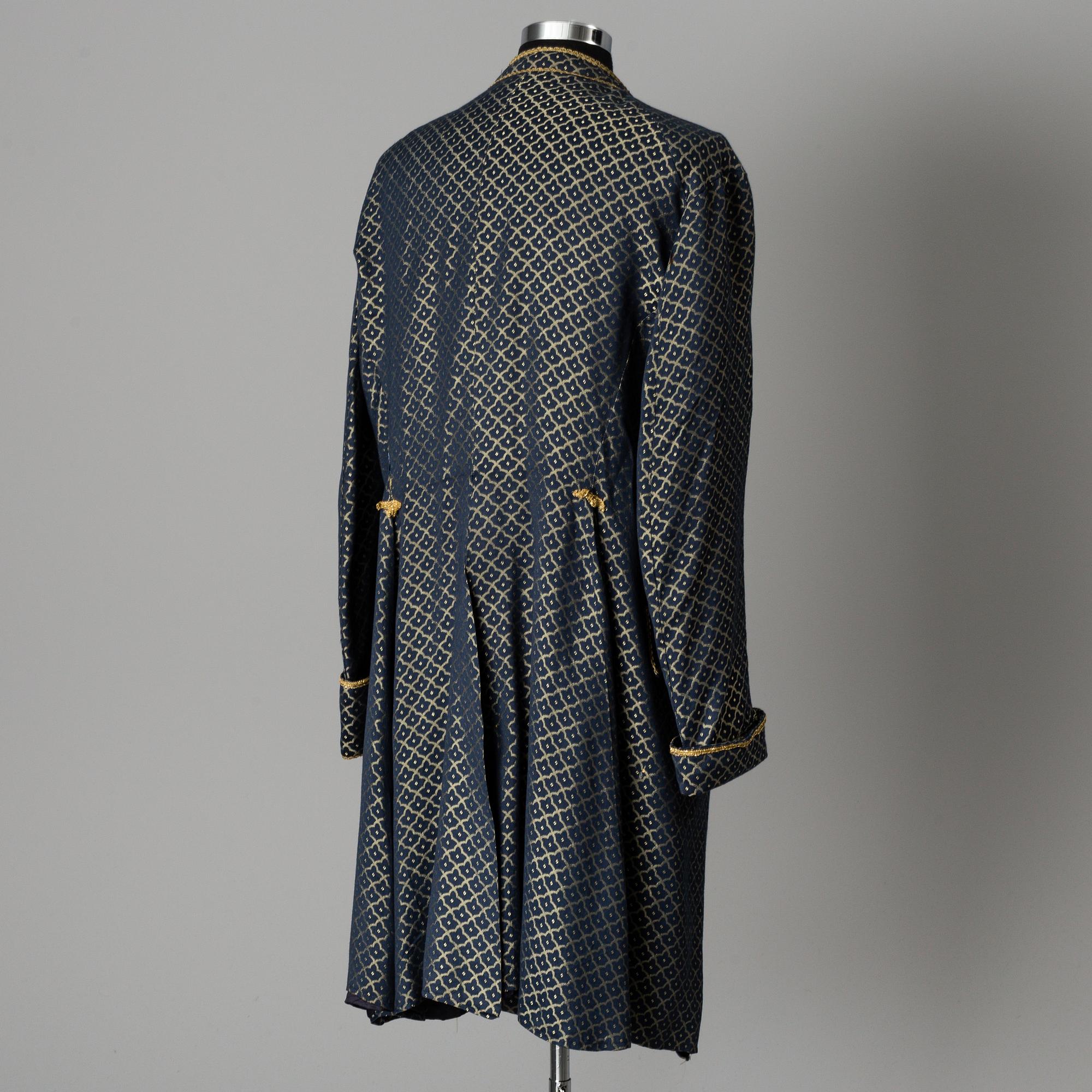 two theater coats from the late 20th century.