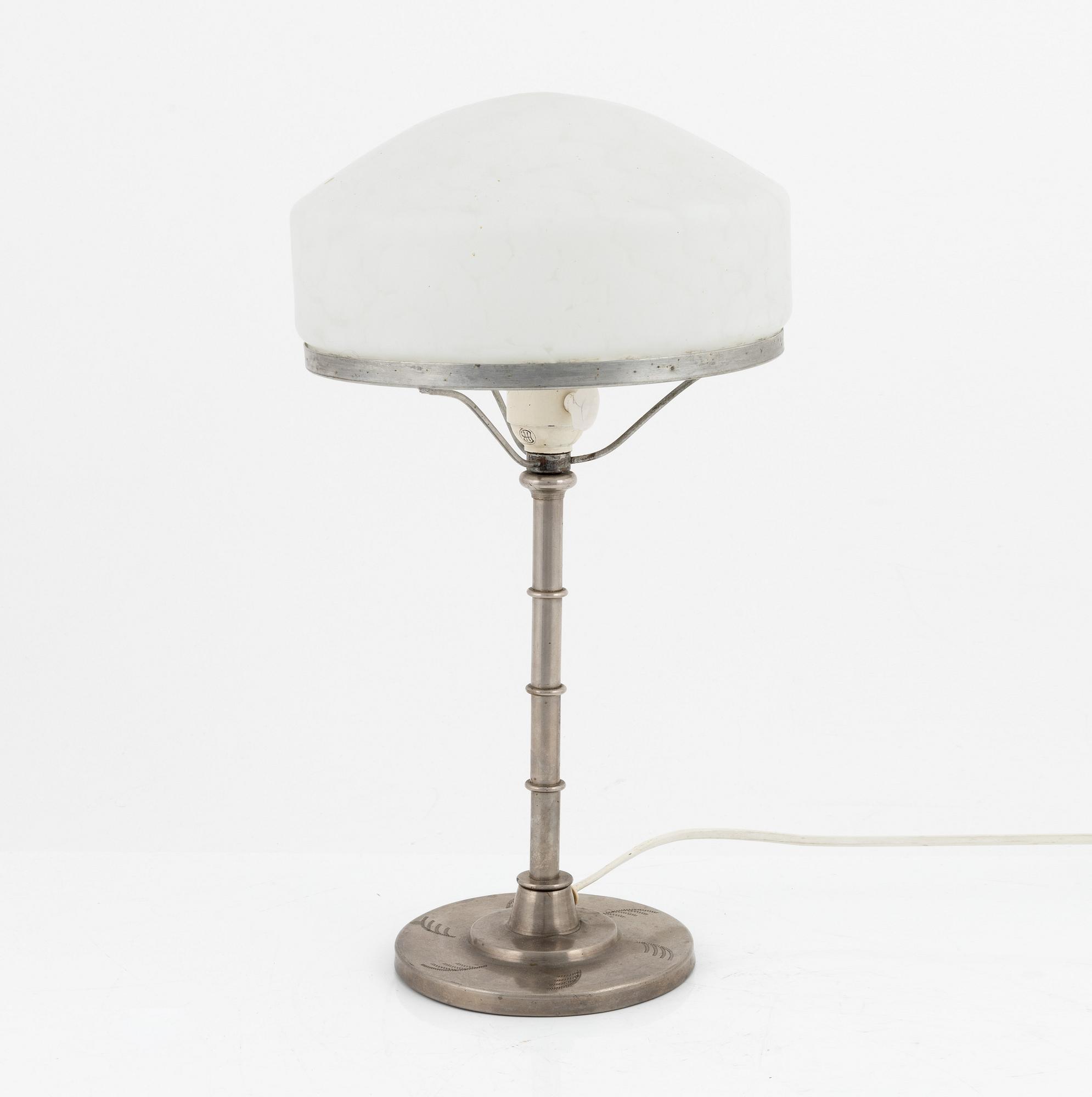 A tin table lamp, first half of the 20th century.