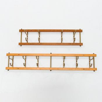 Two mid 20th century brass and teak coat hanger "Dekorativ" from Skoglunds metallgjuteri, Anderstorp.