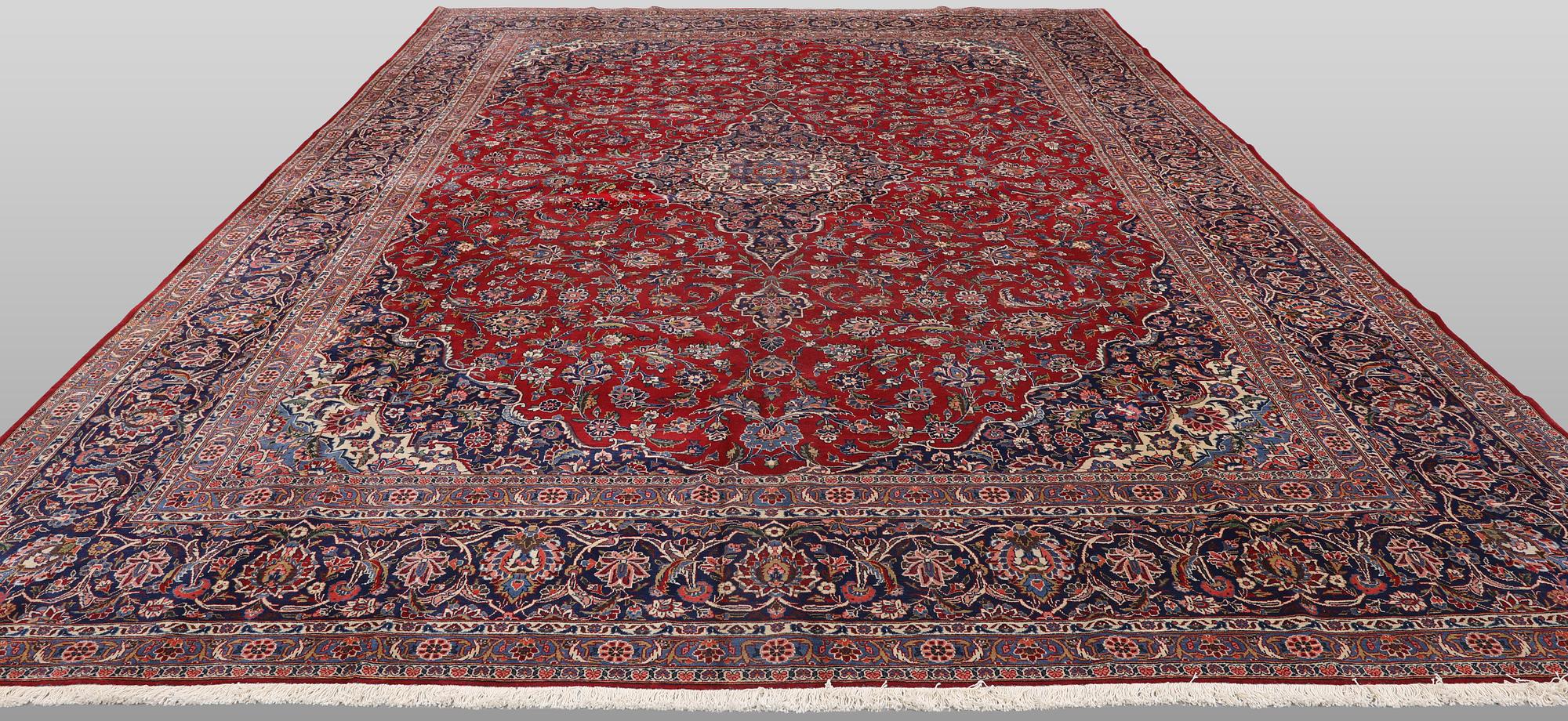 A semi-antique Keshan carpet, signed, 449 x 317 cm.