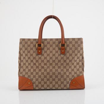 Gucci, a canvas and leather bag.