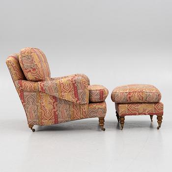 A Howard armchair with ottoman.