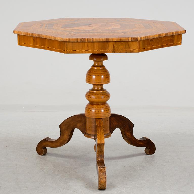 a neo rennaissance table from the late 1800's, possibly from Italy.