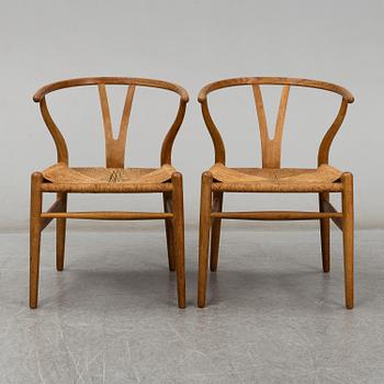 A pair of armchairs, 'Wishbone Chair' by Hans J Wegner, Carl Hansen & Son, Odense, Denmark.