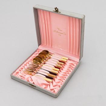 A 12-piece set of 1950s two-tine forks and espresso spoons in gilt silver and enamel, Tillander, Helsinki 1951-55.