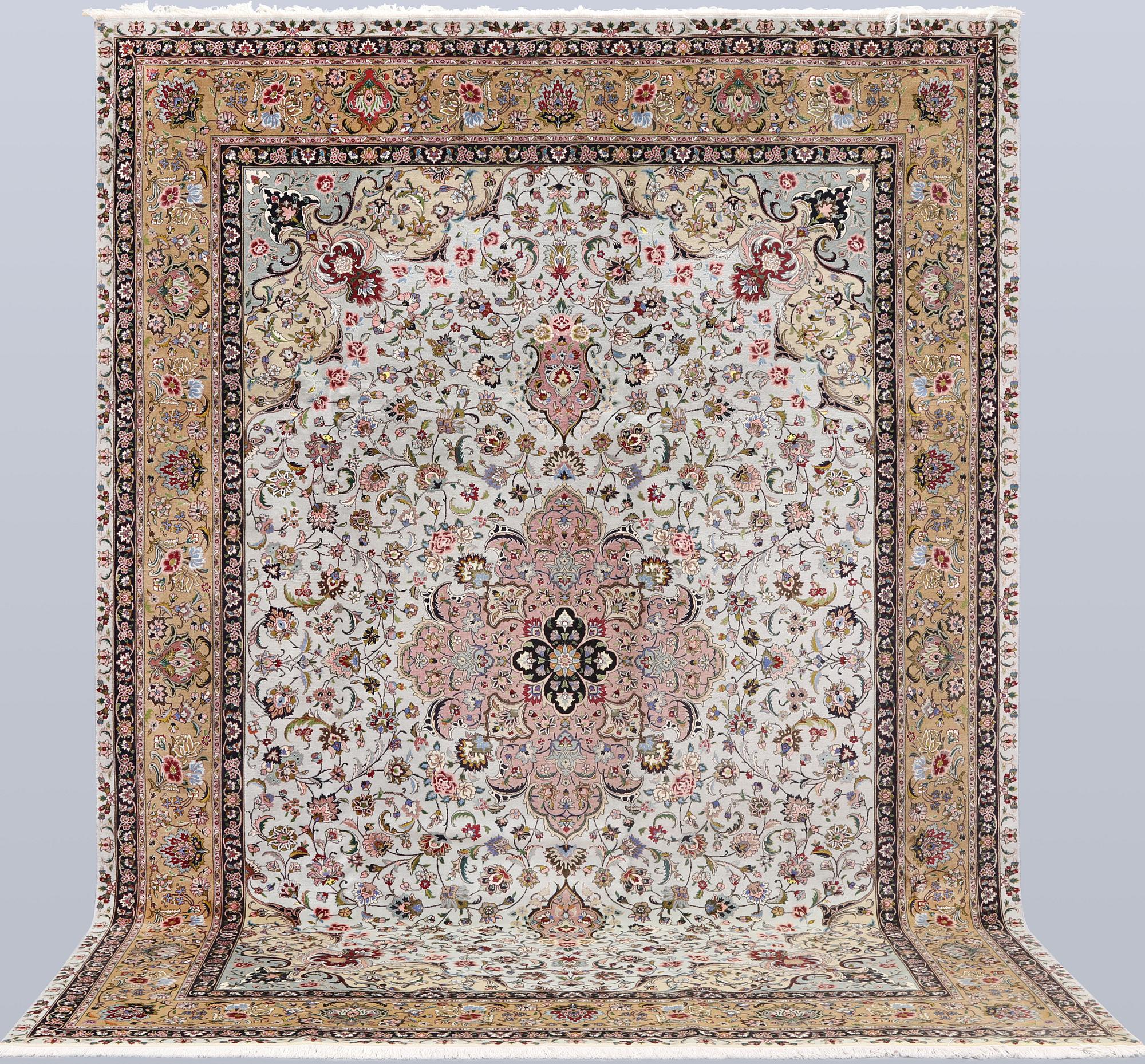 A Tabriz carpet, part silk, so-called 50 Raj, approx. 348 x 252 cm.
