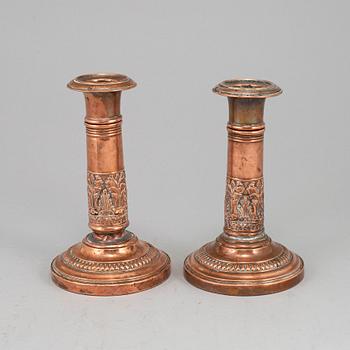 A pair of English early 19th century candlesticks.