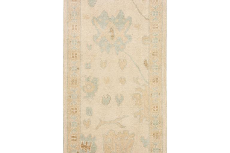 An Ushak runner carpet, c. 360 x 80 cm.