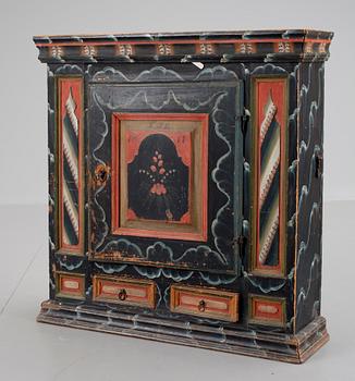 A Swedish wall cabinet dated KJD 1817.