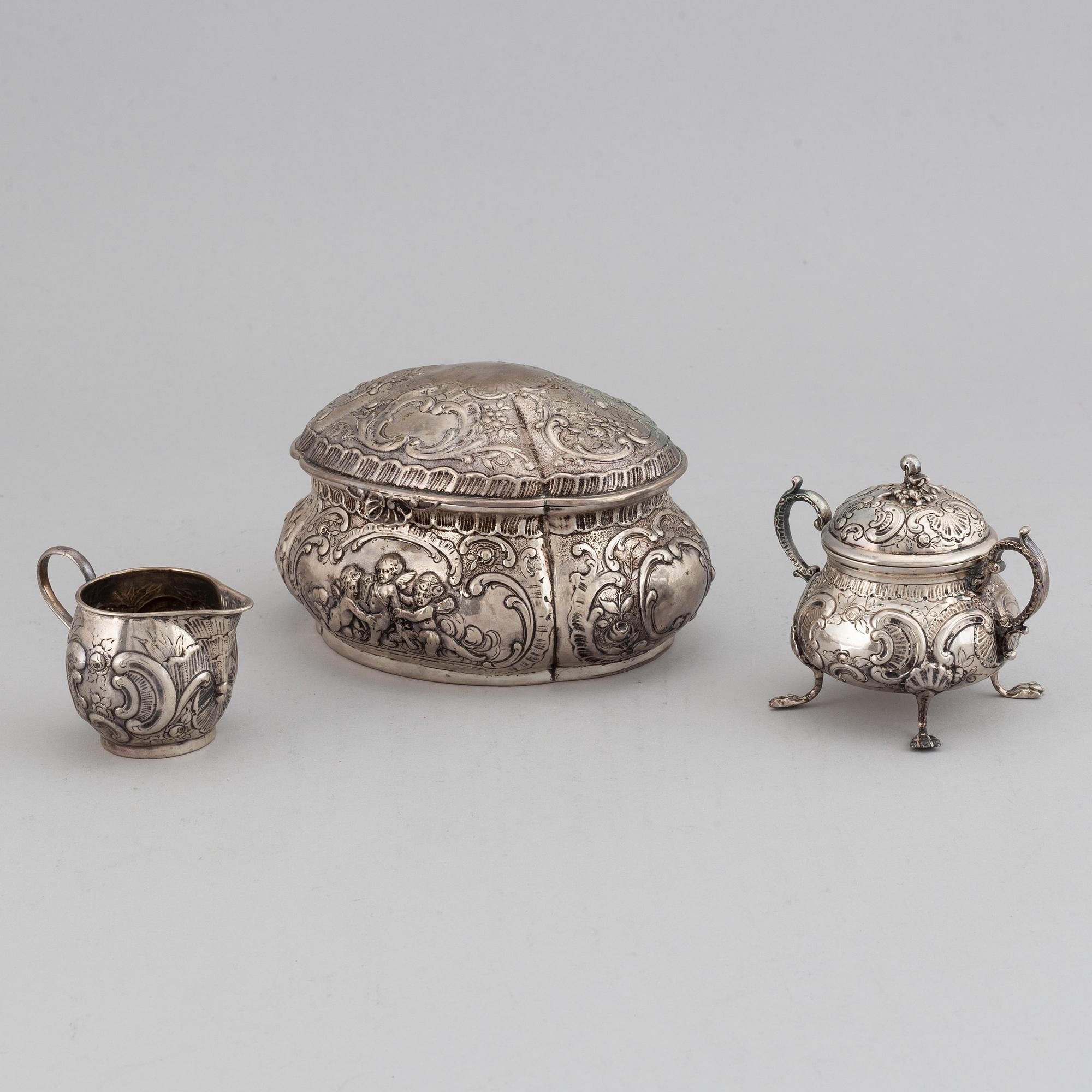 A german silver 800 sugar box, creamer and sugar bowl.