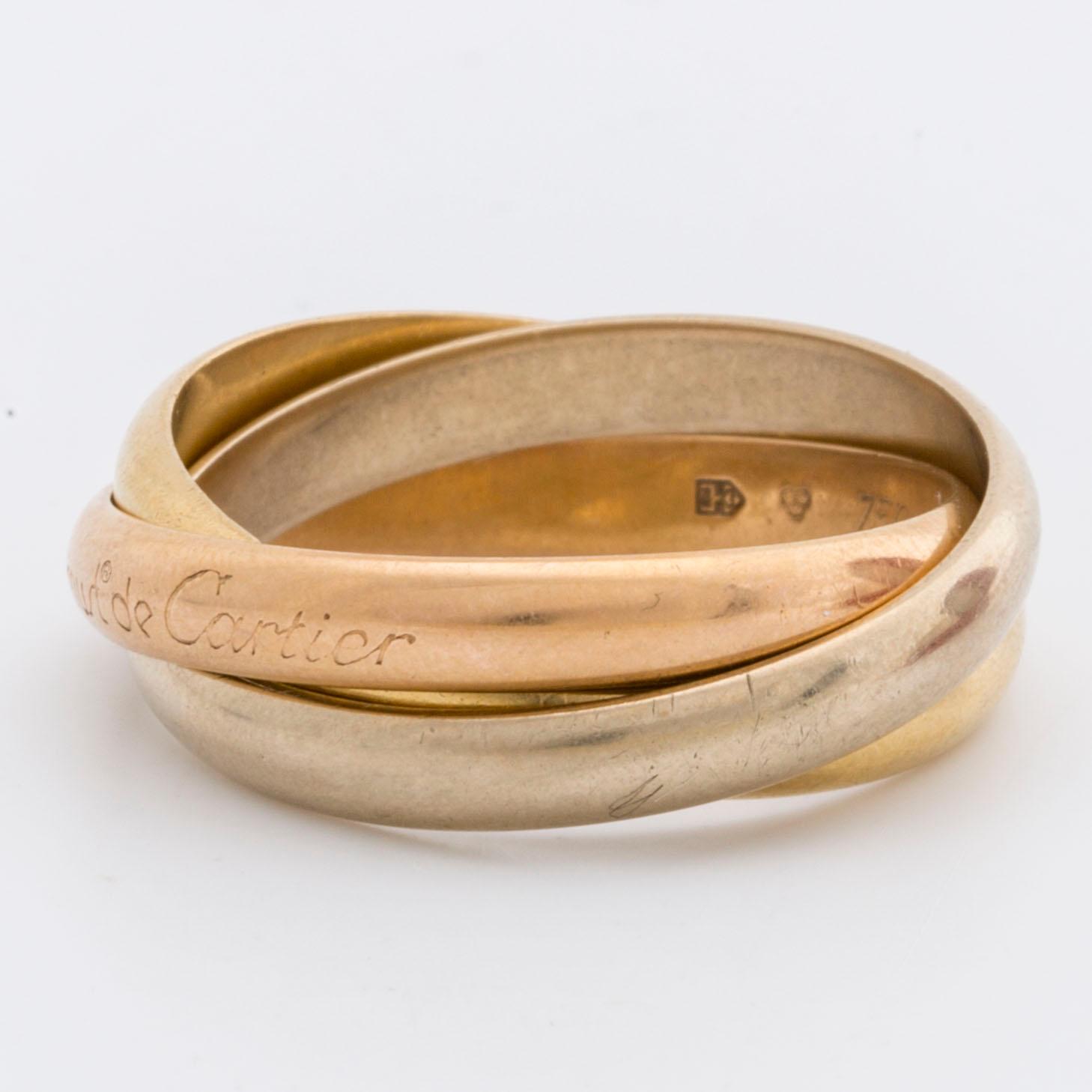 RING "Trinity" Must de Cartier, tri-coloured 18k gold, original case and certifikat.