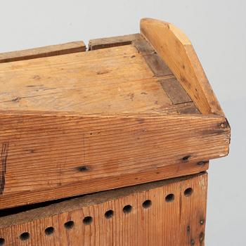 A late 19th century pine cupboard for eggs.