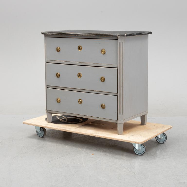 A painted gustavian style chest of drawers, early 20th century.