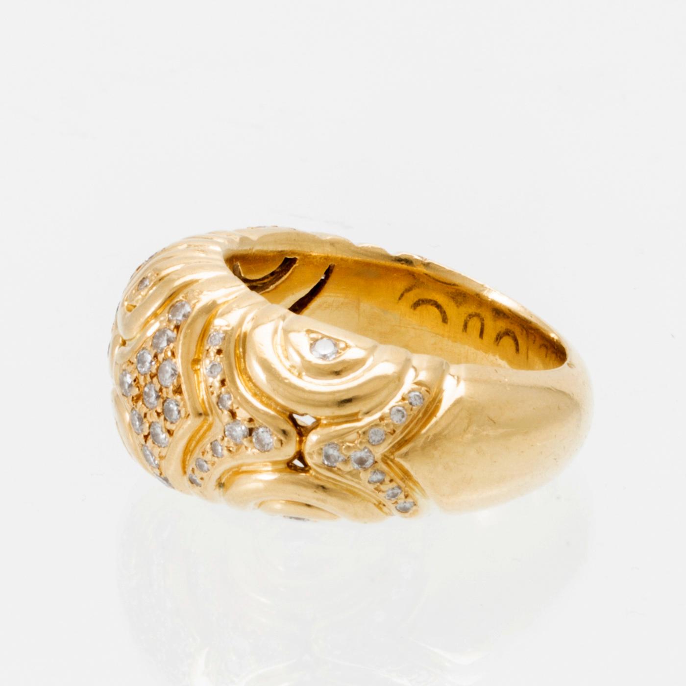 An 18K gold ring set with round brilliant-cut diamonds, London.