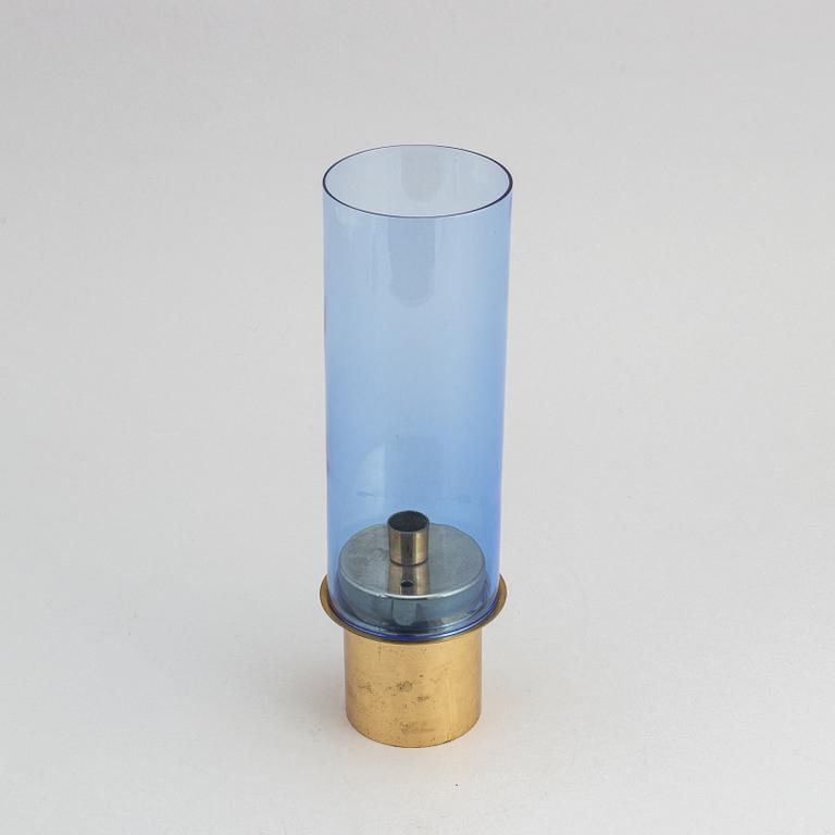 Hans-Agne Jakobsson, a brass and glass candle holder from Markaryd.