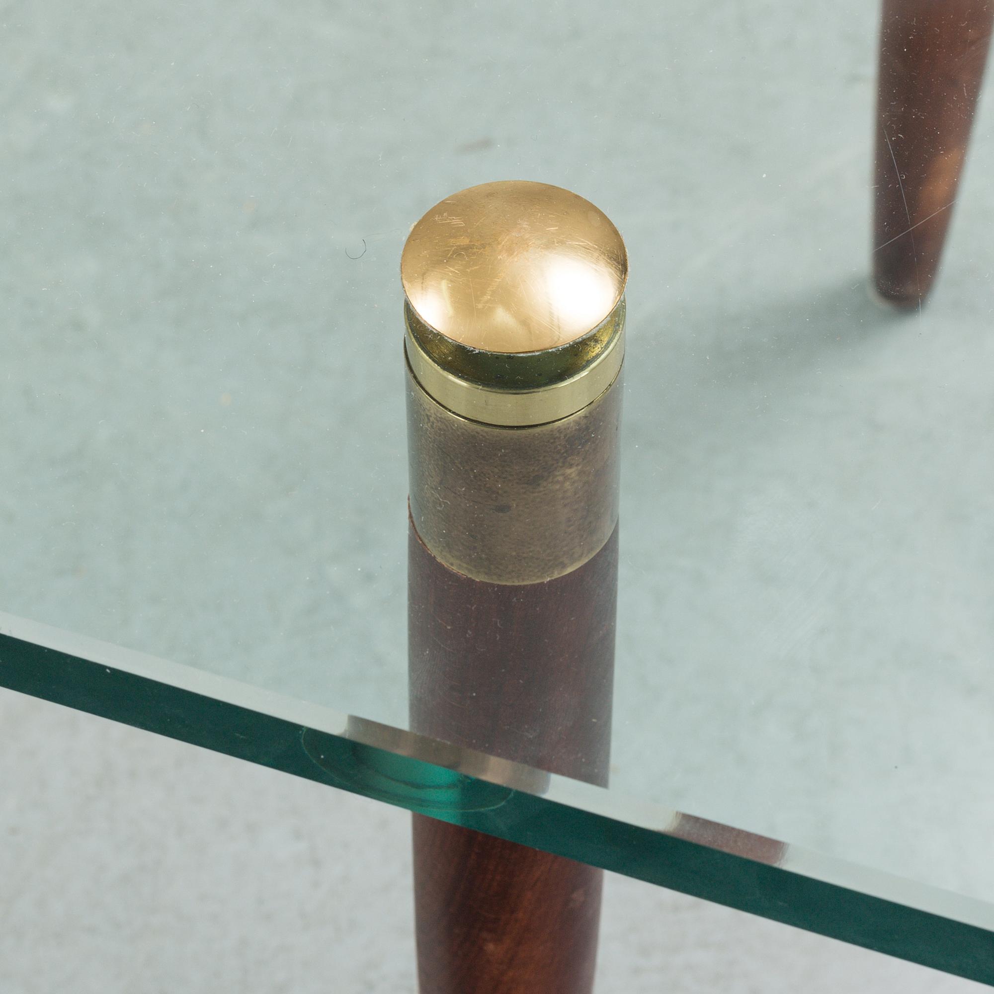 A 1960's glass sofa table.