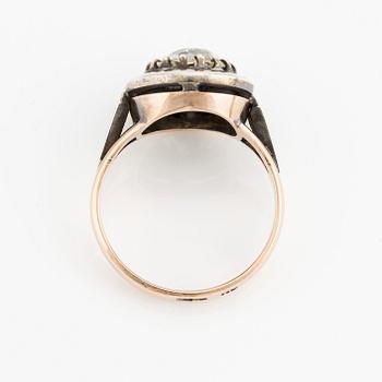 A 14K gold and silver ring with an old-cut diamond.