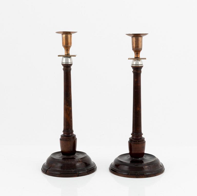 A pair of 19th century candlesticks in wood and brass and white metal.