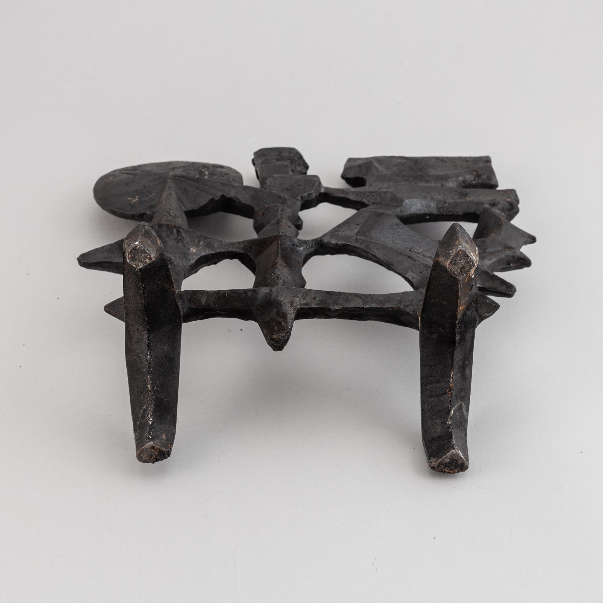 OLLE HERMANSSON, a cast iron sculpture, marked Husqvarna.