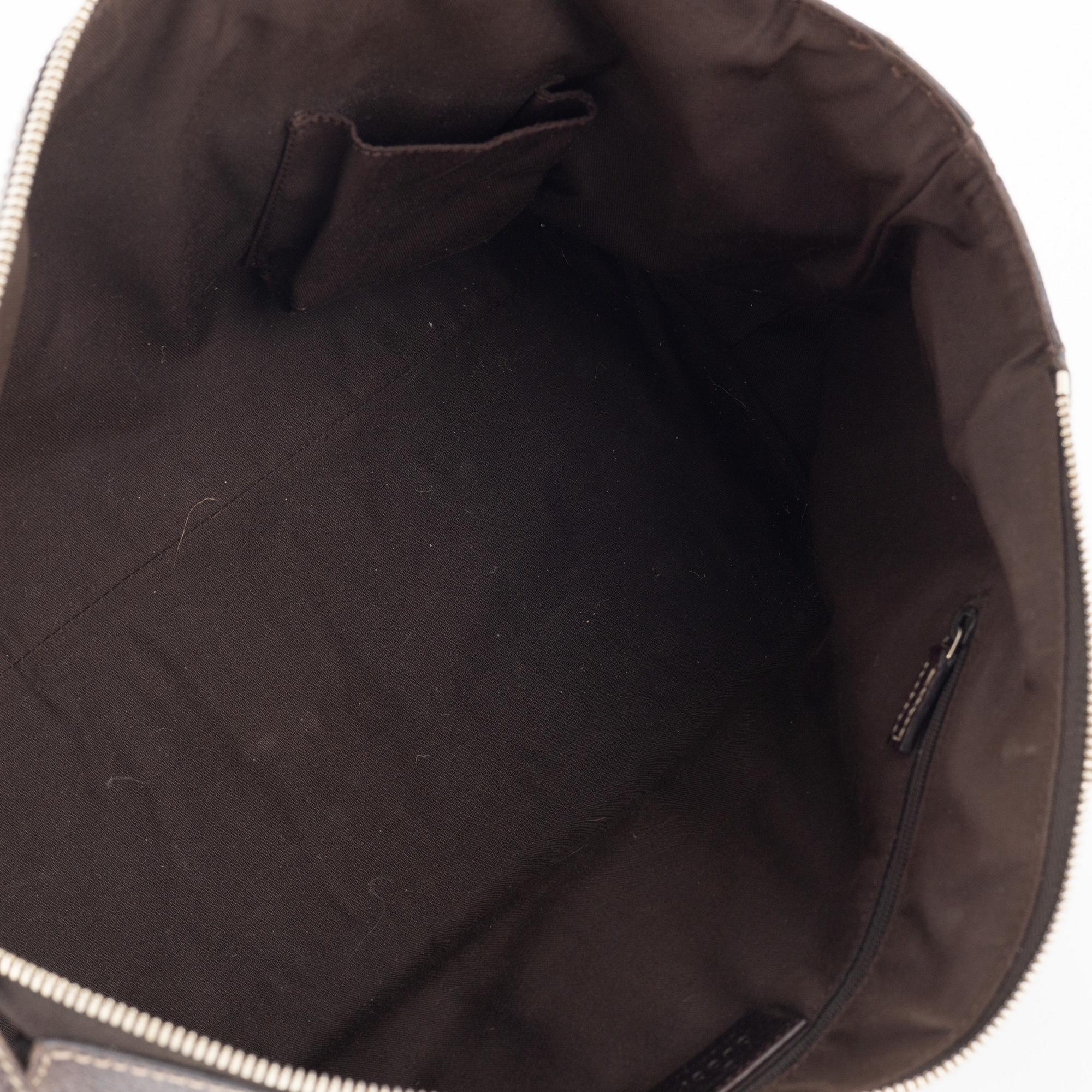 Gucci, a monogram canvas handbag.