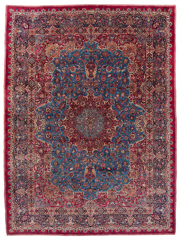 A Mashad carpet, signed Saber, c. 468 x 248 cm.