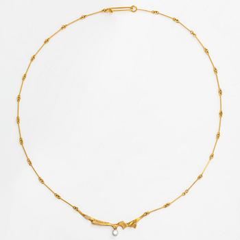 Björn Weckström, an 18K gold necklace 'Surfing', with a diamond approx. 0.10 ct. Lapponia 1983.