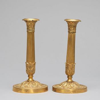 A pair of French Empire-style late 19th ct candlesticks.