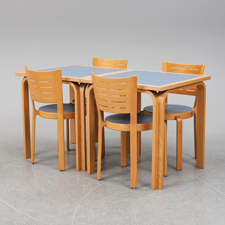 Table with four chairs, late 20th Century by Magnus Olesen.