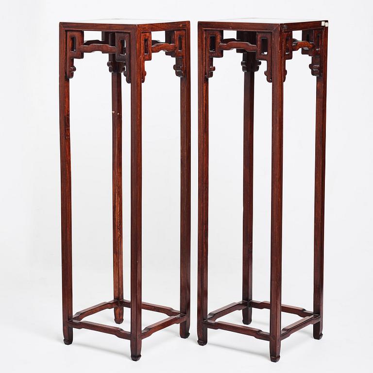 A pair of Chinese pidestals, 20th Century.