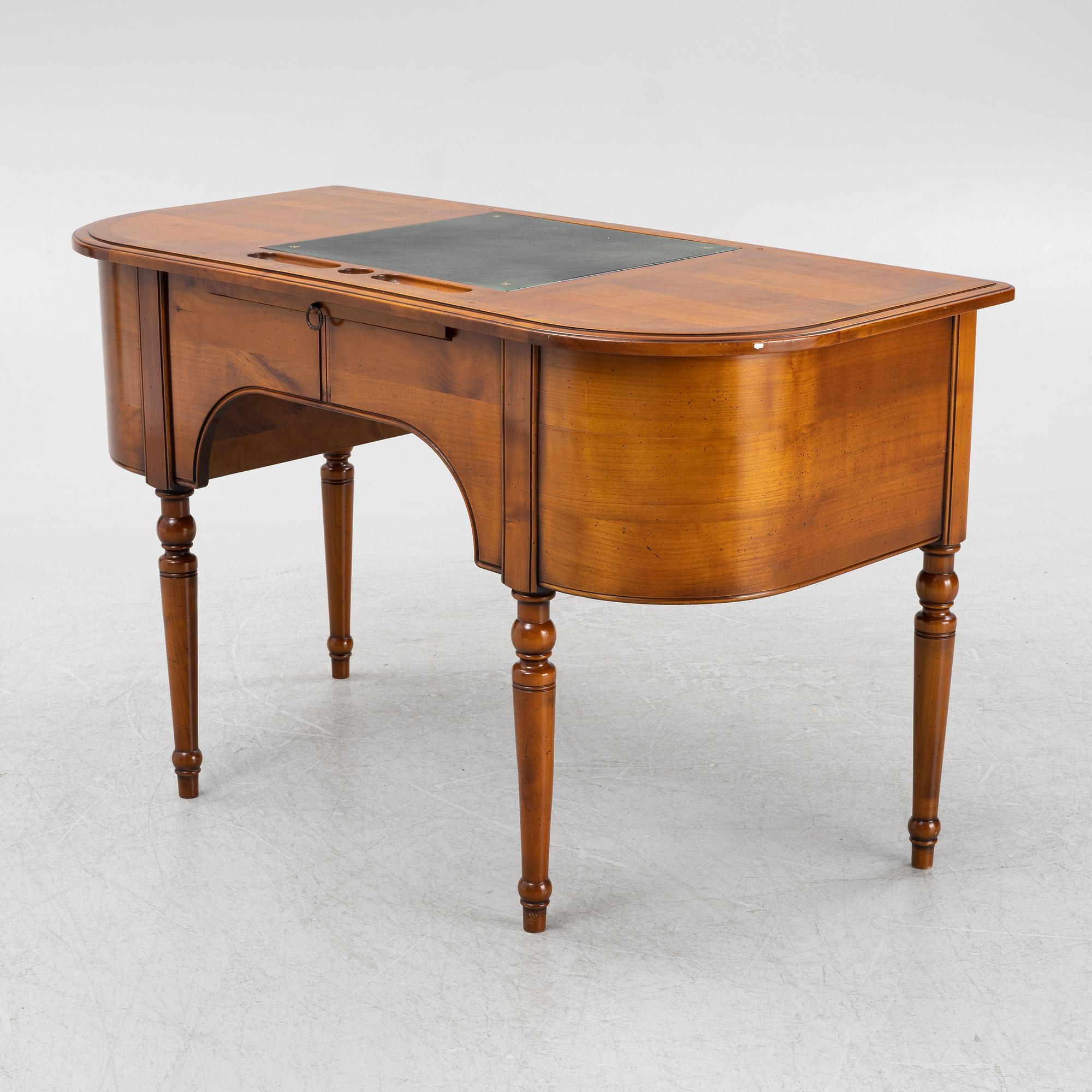 A Cherry wood desk, mid 20th century.