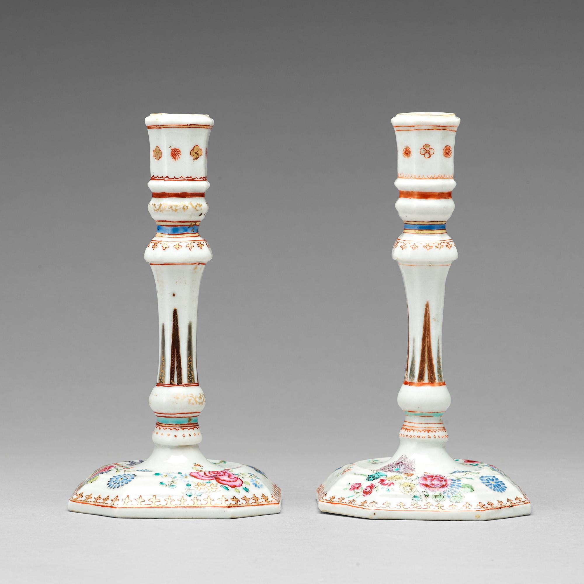 A pair of famille rose candle sticks, Qing dynasty, Qianlong (1736-95).