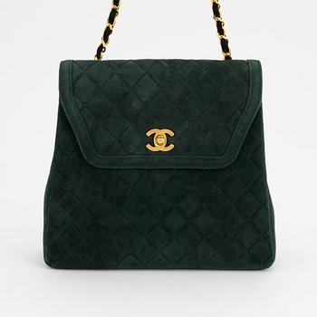 Chanel, a green suede bag with pouch, 1989-1991.