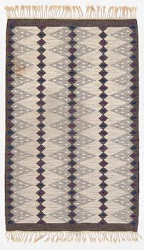 Berit Koenig,a flat weave rug, signed SH BK, c. 208 x 132 cm.