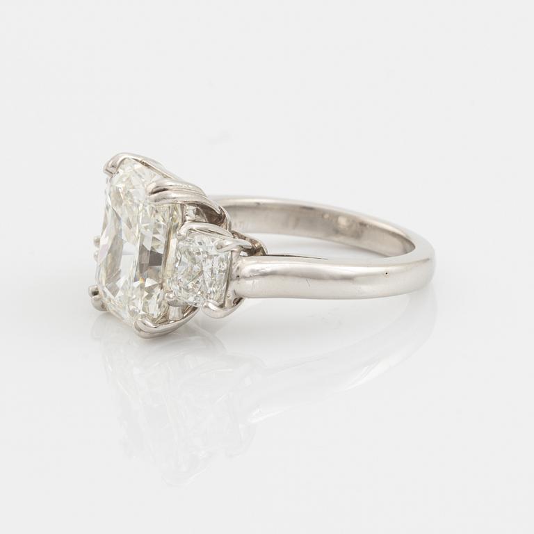 A platinum ring set with a radiant-cut diamond 6.21 ct H vs2, by KWIAT.