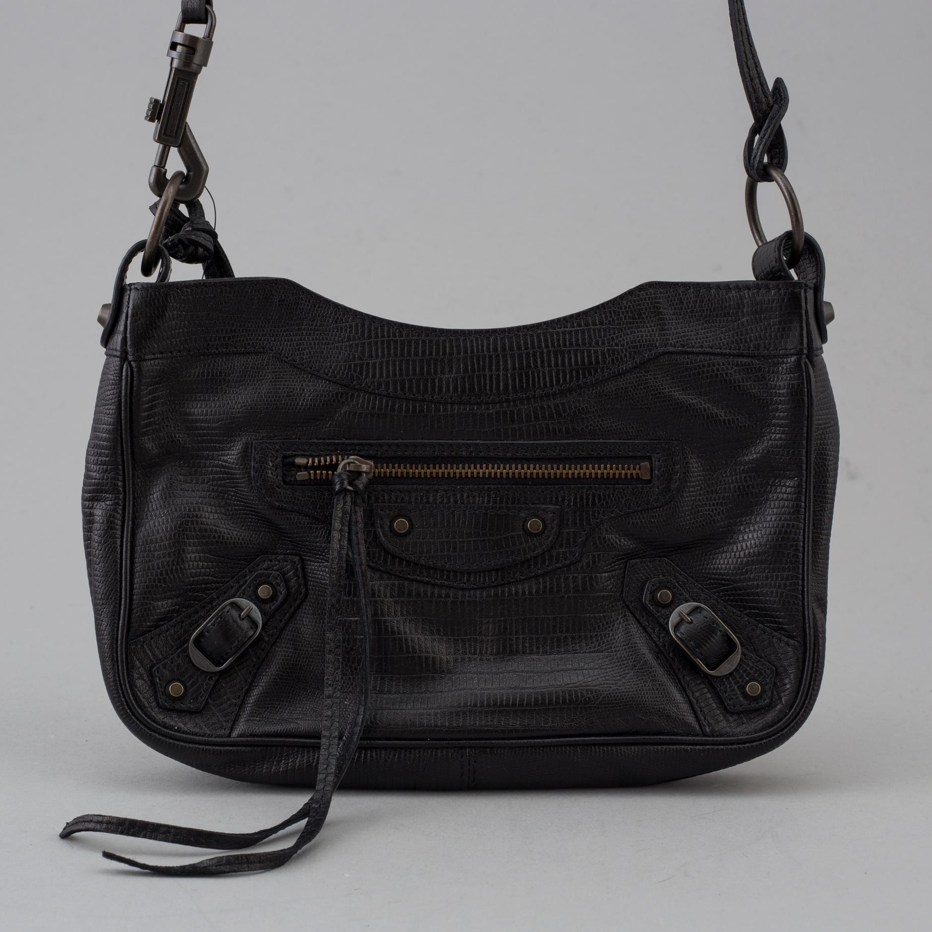 A black alligator printed leather "Classic hip" bag by Balenciaga.