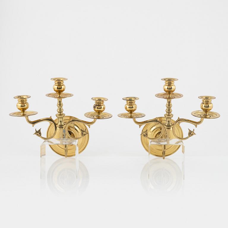 A pair of brass wall sconces, first half of the 20th Century.