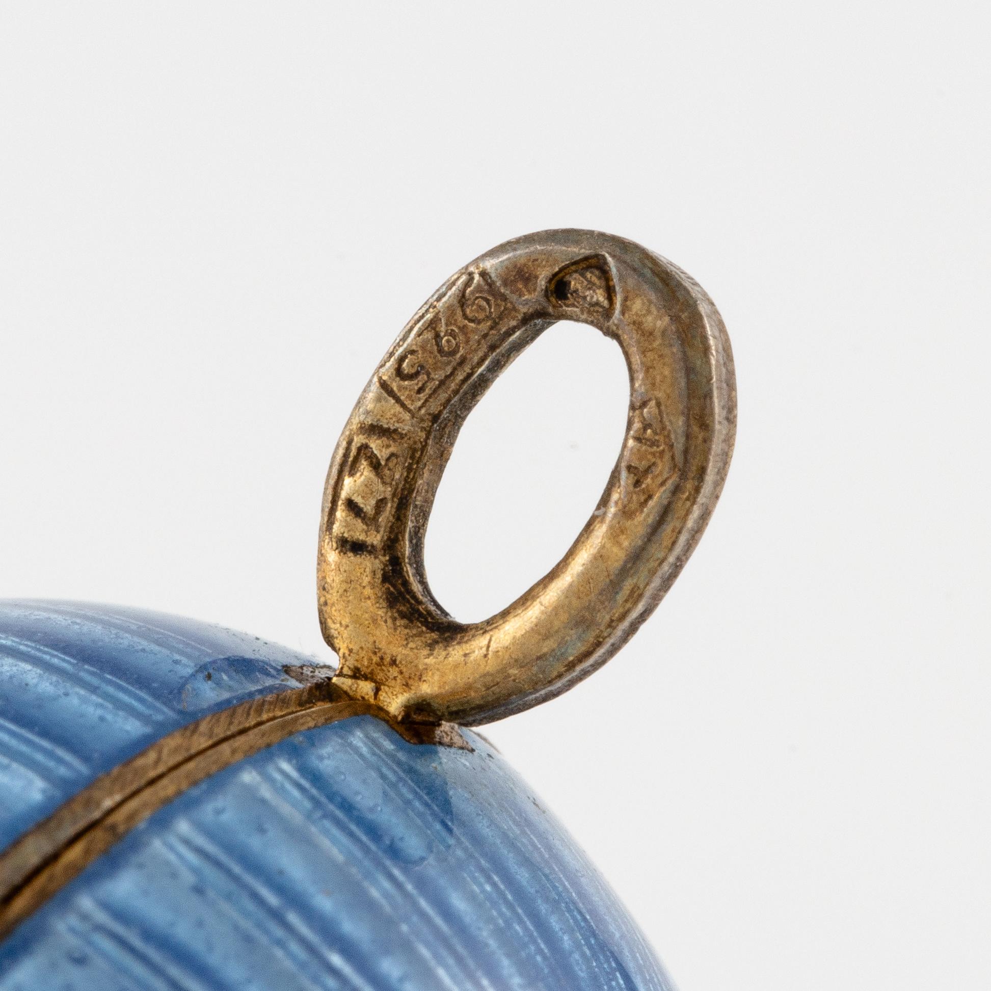 Pendant in the form of an egg, silver and enamel.