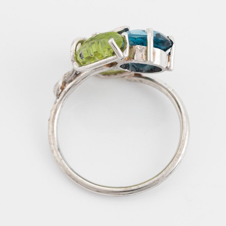 Blue topaz, carved peridot leaf, brilliant cut diamond ring.