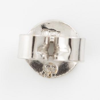 A ring and a pair of earrings in 18K white gold set with round brilliant-cut and octagonal-cut diamonds.