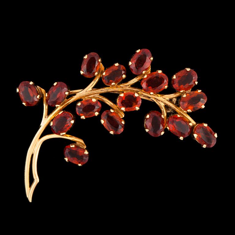 A citrine brooch in the shape of a branch.