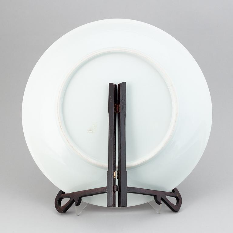 A large Chinese dish with a fierce five clawed dragon, modern.