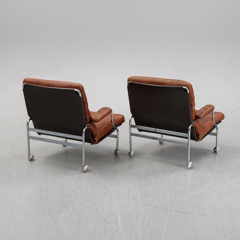 A pair of 'Karin' easy chairs by Bruno Mathsson for Dux, designed 1969.