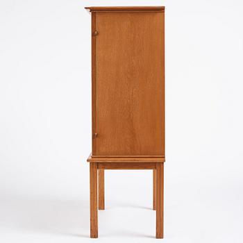 Oscar Nilsson, attributed to, a Swedish Modern oak cabinet, 1940s.