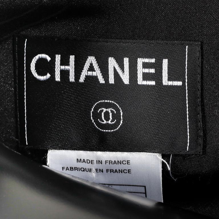 CHANEL, a black short "Chanel bouclé" jacket, 2003.