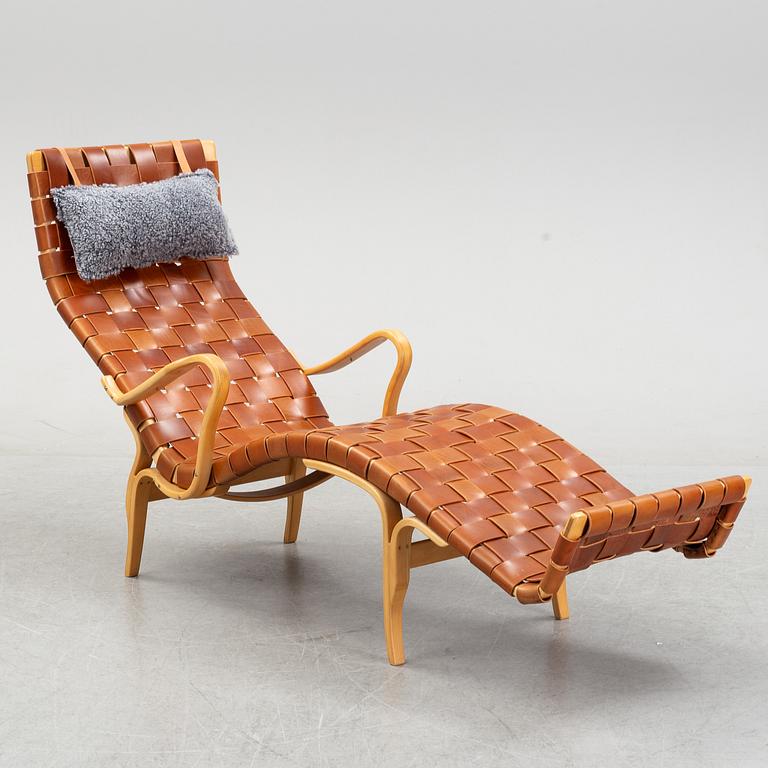 A 'Pernilla 3' lounge chair by Bruno Mathsson for Firma Karl Mathsson, dated 1973.