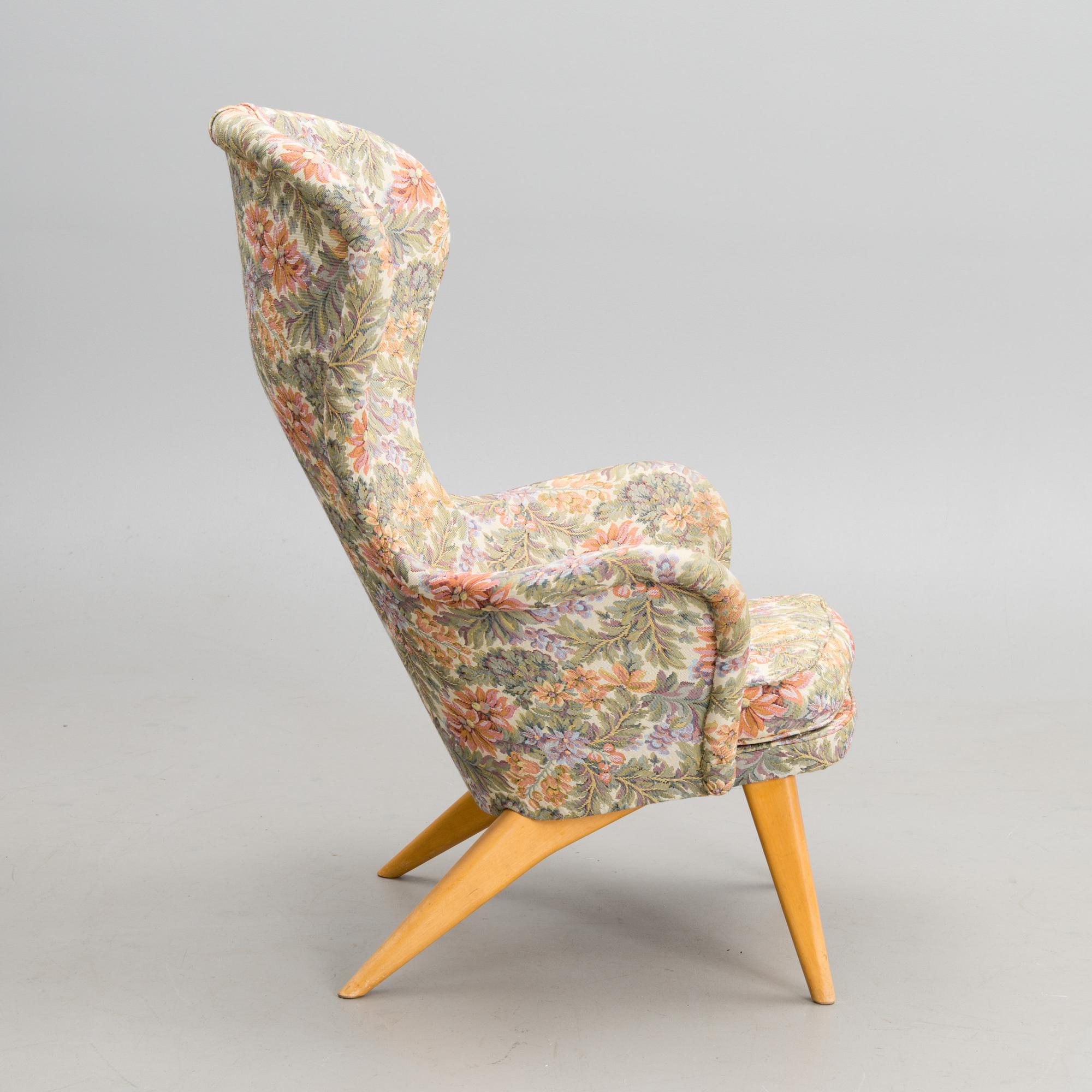 A mid-20th century armchair 'Siesta' manufacturer  Puunveisto Oy - Träsnideri Ab, Finland.