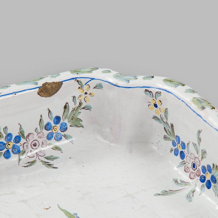 A Swedish Rococo faience tea table, Marieberg 1770.