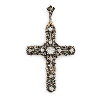 A silver and 14K gold cross with rose-cut diamonds.