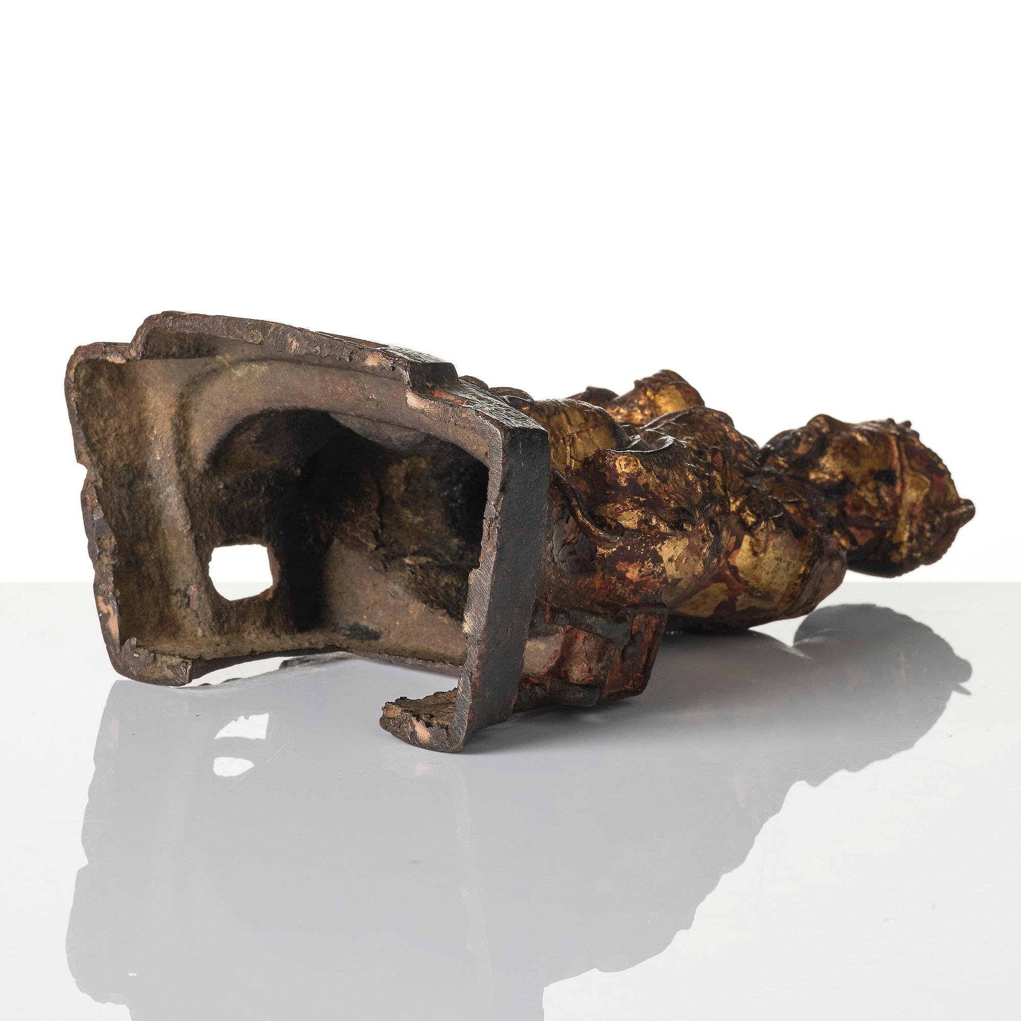 A Chinese gilt lacquered figure of a daoist deity, Ming dynasty (1368-1644).